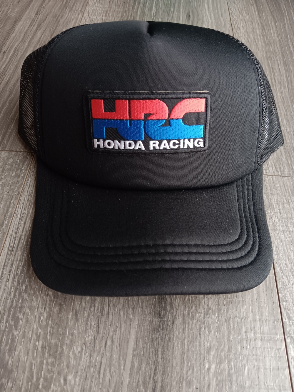 Honda Racing Trucker Hat in Black with Red & Blue Logo